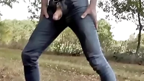 Pissing in jeans and rubber